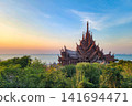 Sanctuary of Truth wooden temple overlooking the Gulf of Thailand at sunset in Pattaya 141694471