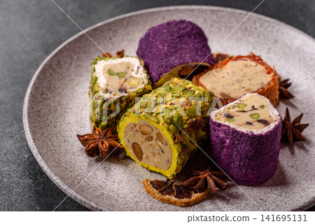 Turkish delight or lokum is a traditional Eastern sweet made with nuts. Turkish delight, lokum Turkish delight or lokum is a traditional Eastern sweet made with nuts. Turkish delight, lokum 141695131
