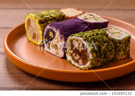 Turkish delight or lokum is a traditional Eastern sweet made with nuts. Turkish delight, lokum Turkish delight or lokum is a traditional Eastern sweet made with nuts. Turkish delight, lokum 141695132