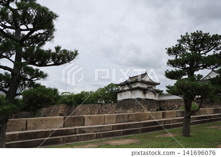 Historic Osaka Castle surrounded by gardens in Osaka Japan Historic Osaka Castle surrounded by gardens in Osaka Japan 141696076