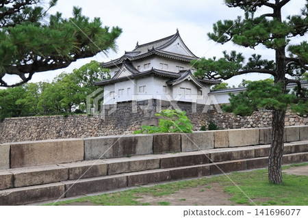 Historic Osaka Castle surrounded by gardens in Osaka Japan 141696077