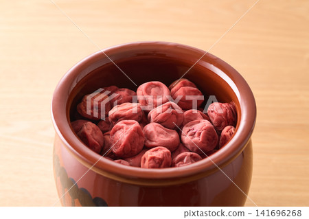 Homemade pickled plums preserved in a jar Homemade pickled plums preserved in a jar 141696268