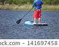 Man enjoying SUP 141697458