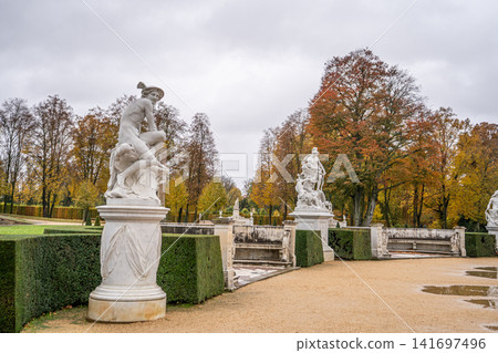 Statue and Benches in Autumn Garden Sanssouci park in Potsdam, Germany Statue and Benches in Autumn Garden Sanssouci park in Potsdam, Germany 141697496