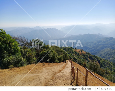 Landscape of The path descending from the summit is steep with a wooden handrail is provided as a crucial safety measure to prevent falls from mountain in Thailand 141697540