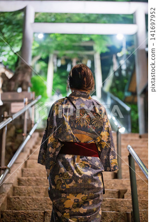 A woman in a yukata A woman in a yukata 141697952