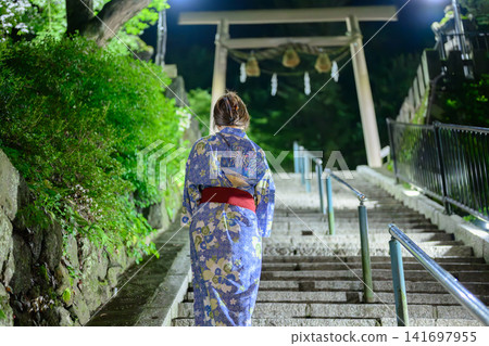 A woman in a yukata A woman in a yukata 141697955