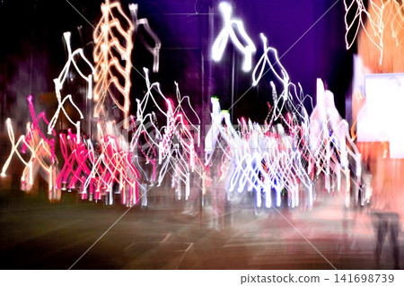 A fantastical light painting where city lights dance, and an abstract night landscape. A fantastical light painting where city lights dance, and an abstract night landscape. 141698739
