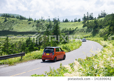 Cars driving across the plateau Cars driving across the plateau 141699042