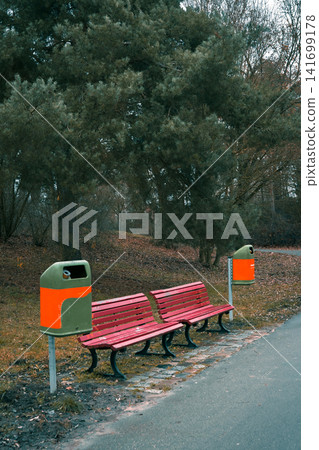 Empty Benches Along a Park Path in Late Autumn Empty Benches Along a Park Path in Late Autumn 141699178