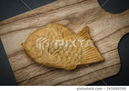 Enjoy delicious taiyaki with tea. Enjoy delicious taiyaki with tea. 141699398