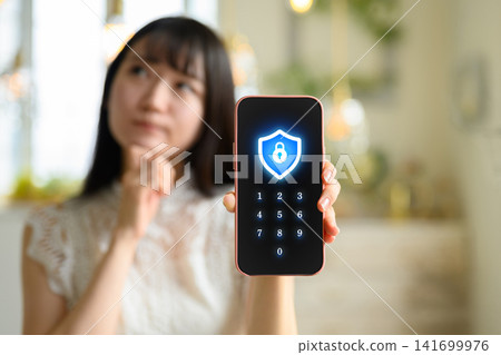 Security icon displayed on smartphone screen Security icon displayed on smartphone screen 141699976