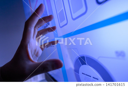 Hands operating the graph on the touch panel Hands operating the graph on the touch panel 141701615