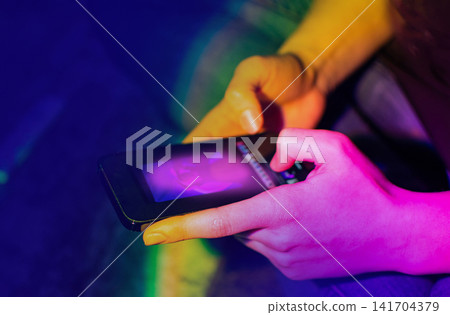 Using social media on smartphones. Woman browsing internet and chatting on social media on mobile cellphone. 141704379