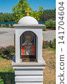 Street chapel or worship pillar with mosaic icon of the Holy Mother of God 141704604