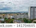 Solid cloud cover over the city at beginning of thunderstorm 141704605