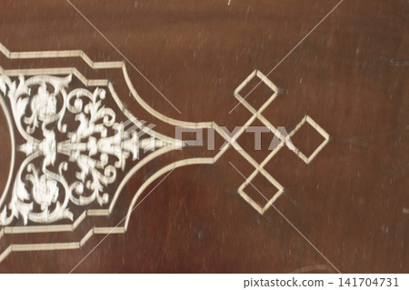 Antique Ivory Inlay Pattern on Polished Wooden Surface Antique Ivory Inlay Pattern on Polished Wooden Surface 141704731