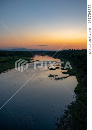 Sunset sky reflected on the river Sunset sky reflected on the river 141704871