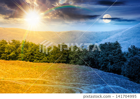 carpathian mountain landscape in summer. day meet night. primeval beech forest on the grassy hill. sun and moon over epic scenery of ukrainian highlands. pristine ecosystem of europe for wallpaper carpathian mountain landscape in summer. day meet night. primeval beech forest on the grassy hill. sun and moon over epic scenery of ukrainian highlands. pristine ecosystem of europe for wallpaper 141704995