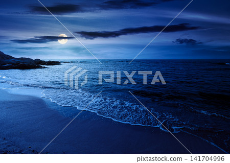 black sea landscape in summer at night. full moon over bulgaria nature landscape with sandy beach. mysterious summer vacation at the sea shore concept. waves and empty beach. remote vacation scene black sea landscape in summer at night. full moon over bulgaria nature landscape with sandy beach. mysterious summer vacation at the sea shore concept. waves and empty beach. remote vacation scene 141704996