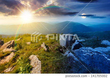 Carpathian mountain landscape on summer solstice. scenic view of Transcarpathia region from the mnt. Smooth. alpine blueberry field with rock on the Polonyna Runa hill at twilight Carpathian mountain landscape on summer solstice. scenic view of Transcarpathia region from the mnt. Smooth. alpine blueberry field with rock on the Polonyna Runa hill at twilight 141705002