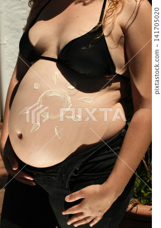 Pregnant woman enjoying a peaceful outdoor maternity lifestyle portrait Pregnant woman enjoying a peaceful outdoor maternity lifestyle portrait 141705020