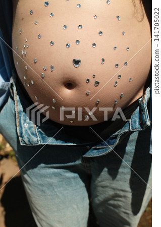 Pregnant woman enjoying a peaceful outdoor maternity lifestyle portrait Pregnant woman enjoying a peaceful outdoor maternity lifestyle portrait 141705022