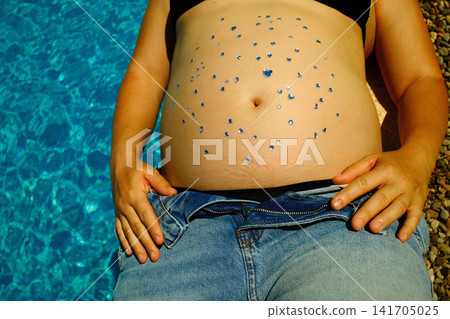 Pregnant woman enjoying a peaceful outdoor maternity lifestyle portrait Pregnant woman enjoying a peaceful outdoor maternity lifestyle portrait 141705025