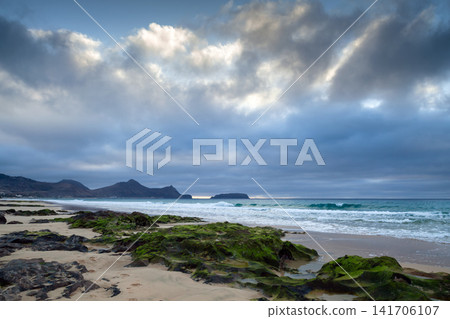Porto Santo, Portugal. A picturesque beach with algae-covered rocks Porto Santo, Portugal. A picturesque beach with algae-covered rocks 141706107