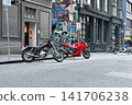 A motorcycle parked at the entrance to Hoger Lane in Melbourne, Australia, and the surrounding streetscape. 141706238