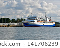A ferry docked in a port on the Sea of Japan, and clouds spreading across the summer sky. 141706239