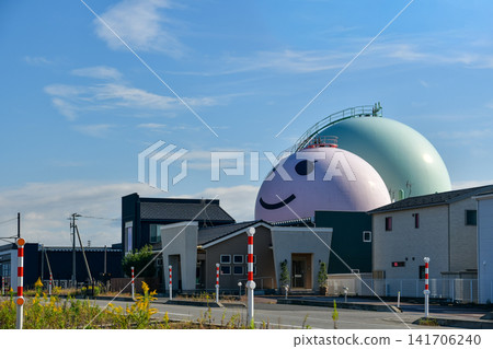 A landscape of gas tanks and a blue sky. A landscape of gas tanks and a blue sky. 141706240