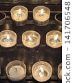 Rows of burning memorial votive candles inside Koelner Dom, Germany 141706548