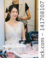 Bride getting her makeup done in the bridal room - wedding Bride getting her makeup done in the bridal room - wedding 141708107