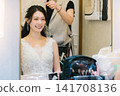 Bride getting her makeup done in the bridal room - wedding Bride getting her makeup done in the bridal room - wedding 141708136