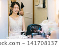 Bride preparing for the wedding ceremony in the bridal room. Bride preparing for the wedding ceremony in the bridal room. 141708137