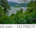 Bali Twin Lakes Viewpoint overlooks both Tamblingan Lake and Buyan Lake in Munduk, Bali Indonesia. Bali Twin Lakes Viewpoint overlooks both Tamblingan Lake and Buyan Lake in Munduk, Bali Indonesia. 141708274
