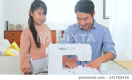 Family conversation sewing machine image Family conversation sewing machine image 141708416