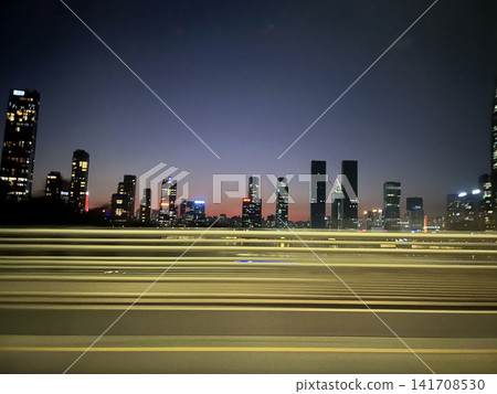 The skyscrapers and urban landscape of Shenzhen, China, at dusk. The skyscrapers and urban landscape of Shenzhen, China, at dusk. 141708530