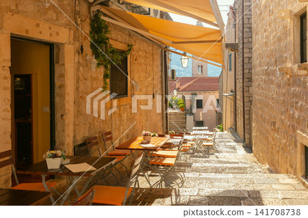 Outdoor Cafe Tables on Historic Stone Street in Dubrovnik Old Town, Croatia Outdoor Cafe Tables on Historic Stone Street in Dubrovnik Old Town, Croatia 141708738