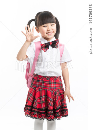 Cute Asian schoolgirl waving hand and smiling, back to school greeting on white background. Cute Asian schoolgirl waving hand and smiling, back to school greeting on white background. 141709388