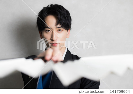 A young man in a hakama with family crest A young man in a hakama with family crest 141709664