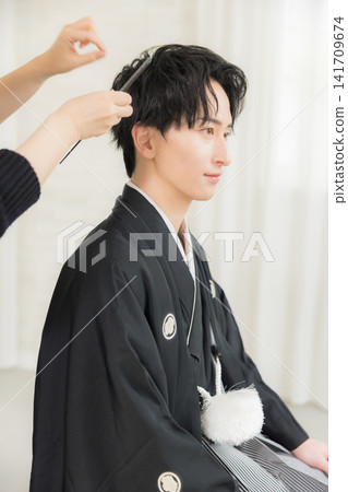 A young man in a hakama with family crest 141709674