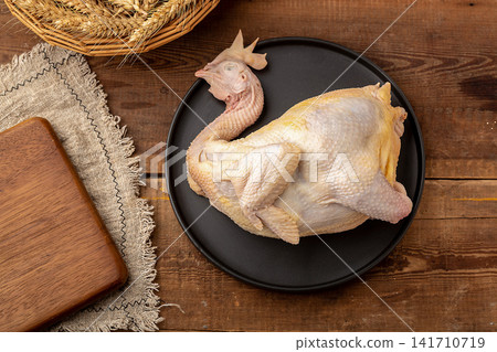 whole raw free-range chicken prepared for culinary cooking whole raw free-range chicken prepared for culinary cooking 141710719