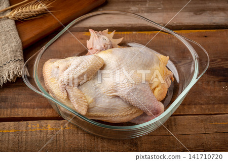 whole raw free-range chicken prepared for culinary cooking whole raw free-range chicken prepared for culinary cooking 141710720