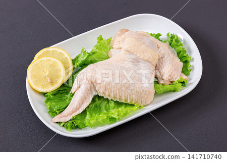 fresh raw whole chicken wings with wingtips attached fresh raw whole chicken wings with wingtips attached 141710740