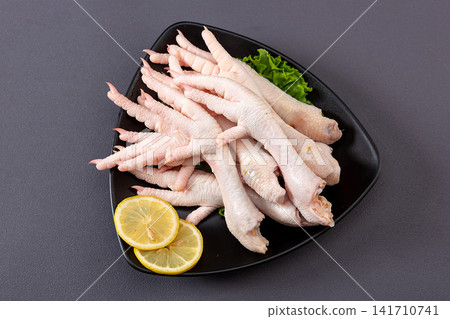 cleaned raw chicken feet prepared for broth and dim sum cleaned raw chicken feet prepared for broth and dim sum 141710741