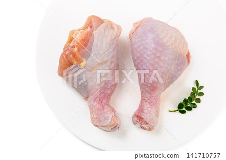 fresh raw chicken drumsticks ready for roasting and grilling fresh raw chicken drumsticks ready for roasting and grilling 141710757