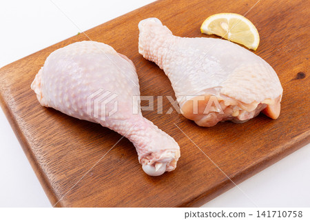 fresh raw chicken drumsticks ready for roasting and grilling fresh raw chicken drumsticks ready for roasting and grilling 141710758