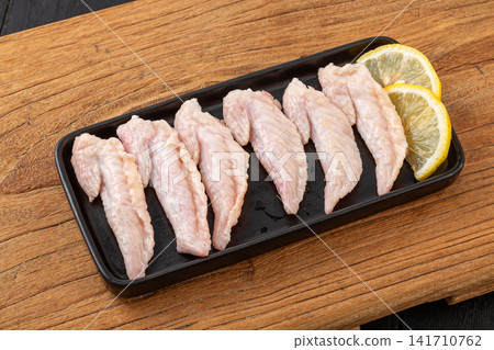fresh raw chicken wingtips for making rich broth and stock fresh raw chicken wingtips for making rich broth and stock 141710762